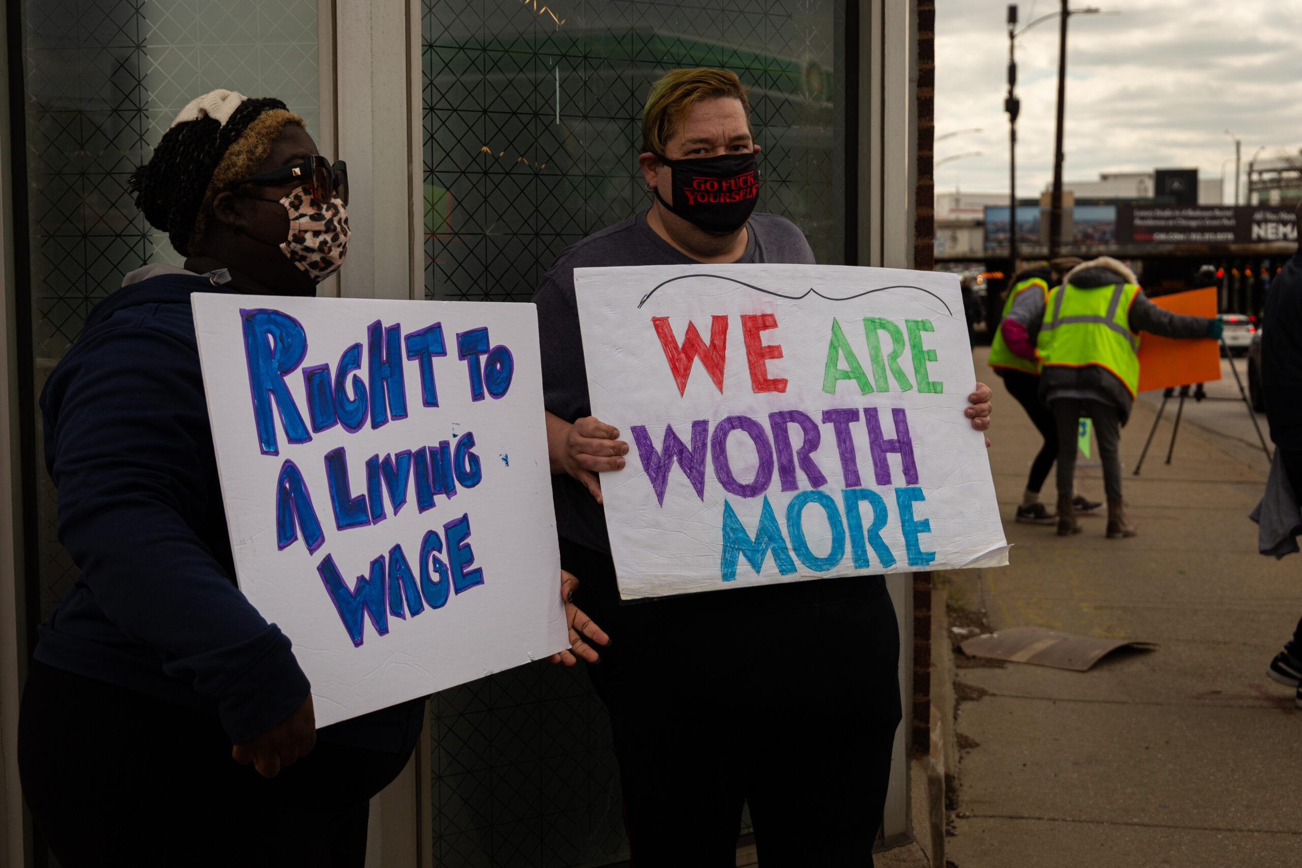 Rideshare drivers demand a living wage at the Uber hub in Chicago.